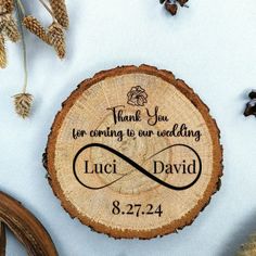 a wood slice with the words thank you for coming to our wedding