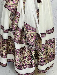 Beautiful Ethiopian and Eritrean Habeshan Dress. Stylish Menen, 100% Cotton We recommend hand washing and air drying to make it last longer. A low heating iron will also keep design and look. Beautiful Habeshan Dress |Ethiopian Traditional Dress|Eritrean Dress|Habesha Kemis|Zuria|Habesha Chiffon|Kemis White Habesha Kemis With Woven Motifs For Traditional Ceremonies, Festive White Folk Habesha Kemis, Festive White Folk Style Habesha Kemis, Habesha Chiffon, Shifon Dress, Eritrean Clothing, Eritrean Dress, Beautiful Ethiopian, Ethiopian Clothing