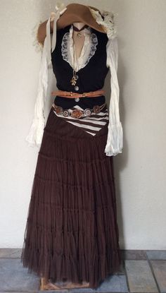 a woman's skirt and shirt on display in a room with tile flooring