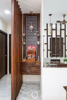 an entry way leading to a living room and dining area with wood accents on the walls