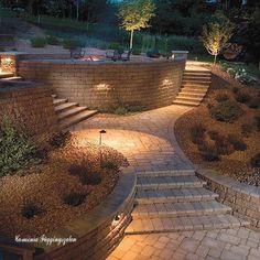 an outdoor patio with steps and lighting