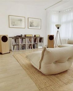 a living room filled with furniture and bookshelves