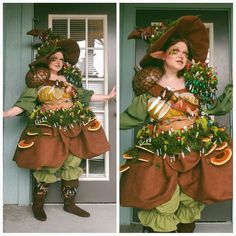 a woman dressed in costume standing next to a door