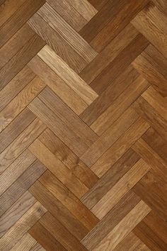 an image of wood flooring that looks like herringbones