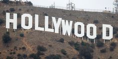 the hollywood sign is on top of a hill