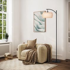 a living room with a chair, lamp and rug on the floor in front of a window