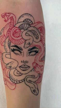 a woman's face with snakes on her leg