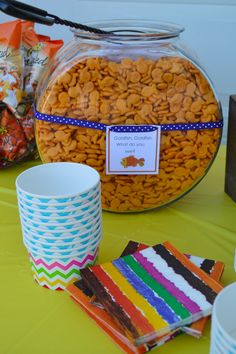 a table topped with lots of candy and snacks