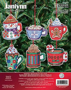 cross stitch christmas ornament kits with coffee mugs and candy canes hanging from the tree