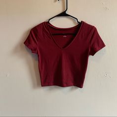 A Slightly Cropped V-Neck Fitted Tee By Wild Fable In A Beautiful Burgundy Color. Size Small. It Is Brand New Never Been Worn, I Ordered Online And Only Wore It To Try It One, Unfortunately The Tags Got Pulled Off While Trying It On So I Can’t Return It As It Was To Small. It’s A Great Tee That Is Super Flattering And Hits All The Right Spots On Your Body. I Know I Reorders A Size Up! Red Fitted V-neck Top, Red Cotton V-neck Crop Top, Red Stretch V-neck T-shirt, Red V-neck Casual T-shirt, Basic V-neck Stretch Crop Top, Trendy Red V-neck Crop Top, Red V-neck Cotton Crop Top, Red Fitted V-neck Crop Top, Spring Red V-neck Crop Top