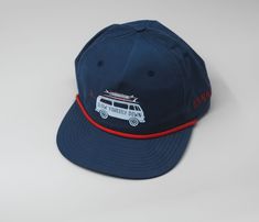 Introducing our Surf Van Boaters Hat – a stylish and sun-smart choice for your outdoor adventures. With UPF 50+ protection and an adjustable snapback, this hat ensures you stay shaded in comfort. Designed to fit most head sizes (OSFM: 7 – 7 3/4), it's a versatile accessory for beach days or casual outings. Elevate your look with the Surf Van Boaters Hat, where every wear is a celebration of sun safety, style, and the art of slowing down to enjoy the great outdoors. Navy Sports Hat For Summer, Navy Curved Brim Sun Hat For Outdoor, Adjustable Flat Bill Beach Hat, Adjustable Fit Flat Bill Hat For Beach, Adjustable Flat Bill Hat For Beach, Summer Outdoor Trucker Hat With Flat Bill, Outdoor Snapback Hat With Flat Brim, Summer Travel Snapback Hat With Flat Bill, Navy Baseball Cap With Flat Bill For Outdoor