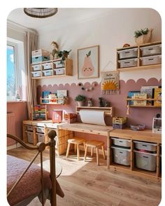 a child's bedroom with pink walls and wooden furniture, including desks and shelves