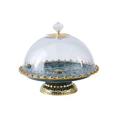 a glass dome with gold trimmings on the top and bottom, sitting on a stand