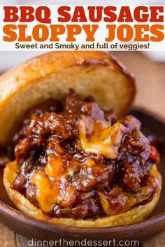 a bowl filled with bbq sausage sloppy joes on top of a wooden table