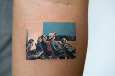 an image of people sitting in chairs on the side of a man's arm