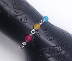 "Handmade sterling silver bracelet. Different colored crystal beads making up the pansexual pride flag. Sterling silver chain. Also pretty as anklet. Order 1.5 cm (1/2\") longer than the intended wearers wrist for a proper fit. Matching necklace: https://www.etsy.com/listing/1024570147 You order not the exact item on the image, but it's likeness to your specified length. Please contact the shop owner for other dimensions than listed. 5.5\" (13.9 cm) 6\" (15.2 cm) 6.5\" (16.5 cm) 7\" (17.8 cm) 7. Pride Flag Jewelry, Pansexual Jewelry, Pansexual Pride Day, Bisexual Flag Necklace, Pansexual Shirt, Beads Making, Scandinavian Jewelry, Leather Choker Necklace, Pansexual Pride