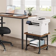 an office desk with a printer on it