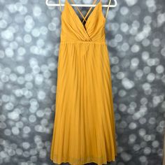 Nwt Saints And Secrets Mustard Yellow Chiffon Pleated Midi Dress. Wrap Style V Neck Top With Adjustable Straps That Cross In The Back And A Line Pleated Bottom Designed To Hit Between Mid Calf And Ankle. Hidden Zipper Closure On The Side. Size Xs. Length Approximately 44in (Straps Are Adjustable) Yellow Chiffon V-neck Maxi Dress, Yellow V-neck Chiffon Dress For Party, Yellow V-neck Chiffon Party Dress, Elegant Yellow Pleated Maxi Dress, Yellow Chiffon Maxi Dress For Evening, Yellow Chiffon Evening Maxi Dress, Yellow Chiffon Party Dress, Fitted Yellow Pleated Midi Dress, Elegant Yellow Maxi Length Chiffon Dress