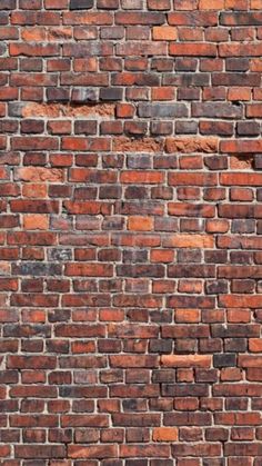 an old red brick wall is shown in this image