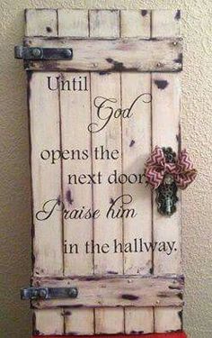 an old door with a bow on it that says, until god opens the next doors please him in the hallway