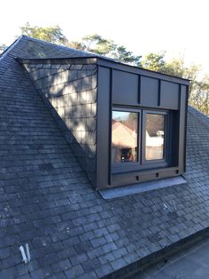 an image of a roof that has a window on it