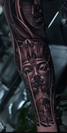 an arm with some tattoos on it