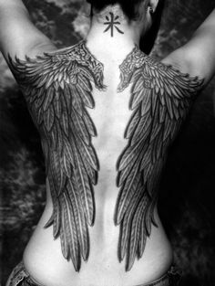 a woman with wings on her back and the words never let a man clip your wings