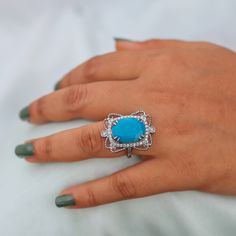 Natural 1.49 Ct. Oval Shape Turquoise Gemstone Pave Diamond Cocktail Ring Solid 14k White Gold Handmade Jewelry Anniversary Gift For Women                                                         ►Gemstone: Natural Turquoise  ►Base Metal: Sterling Silver (S925) ►Plating: Rhodium Plating ★Natural  Turquoise  stone cannot be always the same, gemstone colour may change in different light/background condition. ★Gemstone size: ★Center Stone - 10 mm x 12 mm ★Center Stone Weight- approx. 5 carat ★Band measurements: approx. 1.8mm wide, approx. 1.5mm thick ★Pictured in Gold Vermeil, available also in White Rhodium or rose gold vermeil. Also available in solid gold. ★ In Sterling Silver Option All Jewelry Will Be Rhodium Plated. ♥ Packaging: All jewelry comes in a beautiful and careful packaging 🛍 I Gift Turquoise Diamond Ring With Center Stone, Gift Turquoise Ring With Diamond Center Stone, Formal Fine Jewelry Turquoise Ring With Accent Stones, Formal Turquoise Rings With Gemstone Accents, Oval Turquoise Ring With Stone Setting Gift, Oval Turquoise Ring For Wedding, Oval Turquoise Ring With Stone Setting, Elegant Diamond Turquoise Ring As A Gift, Elegant Turquoise Ring With Stone Setting