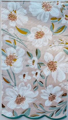 a close up of a cloth with flowers on it