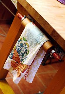 a kitchen towel hanging from a wooden table