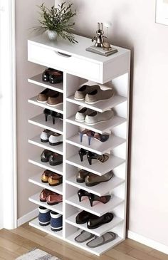 a white shoe rack with many pairs of shoes