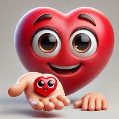 a red heart with two eyes and a hand holding a small toy in front of it