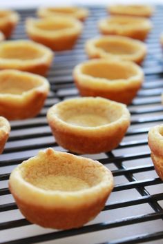 several mini pies on a cooling rack ready to be baked in the oven for consumption