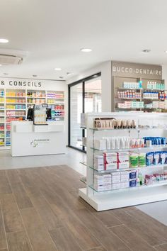 the inside of a pharmacy store with shelves full of medicine and other medical supplies on display