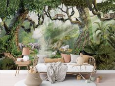 a living room with an animal mural on the wall and couch in front of it