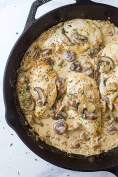 chicken with mushrooms and gravy in a cast iron skillet