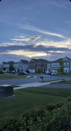 an empty street with houses in the background