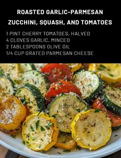 roasted garlic - parmesan zucchini, squash, and tomatoes on a white plate