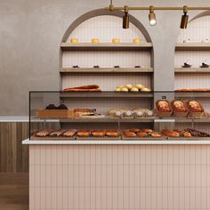 a bakery counter with breads and pastries on it