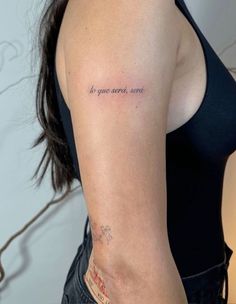 a woman with a tattoo on her arm that says, do you want something?