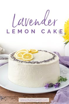 a white cake with lemon slices on top and lavender sprinkles around the edges