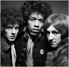 three people with curly hair posing for a photo