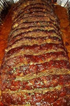 the meatloaf is covered with sauce and seasonings