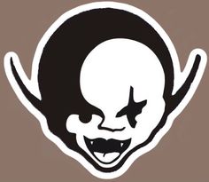 an image of a creepy clown face sticker on a white and brown background,