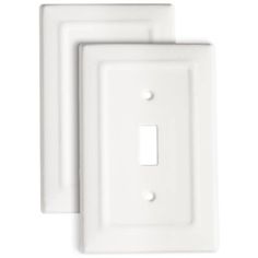 two white wall plates with one light switch