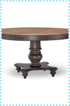 an oval dining table with wooden top and metal base, on a blue polka dot background