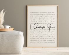 a framed print with the words i choose you in cursive writing on it