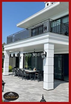 an outside view of a building with tables and chairs