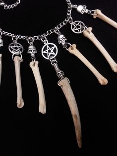 Have a Look at This Beautiful Coyote Bone Necklace! It was Made With 6 Real Coyote Paw Bones, And One Antler Point. There are 5 Metal Skulls and 3 Pentagrams Hanging with The Coyote Bones. This Necklace is Adjustable up to 20 Inches All Bone Jewelry Orders Over 35 USD $ Ship for FREE (USA Only) All Items Ship Within 1-3 Days via USPS First Class Service. Shipping on This Bone Necklace is 4.50 International Shipping Will Be 16.00, And All Additional Items Add 4.00 to the Shipping Cost. Internatio Bone Art Diy, Cryptid Academia, Bone Jewellery, Bone Decor, Creepy Jewelry, Real Bone Jewelry, Animal Skull Decor, Animal Bone Jewelry, Oddities Jewelry