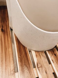 a white bowl sitting on top of a wooden table